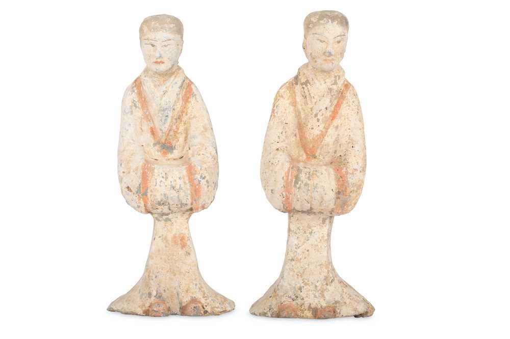 Lot 311 - A PAIR OF CHINESE POTTERY FIGURES OF SERVANTS.