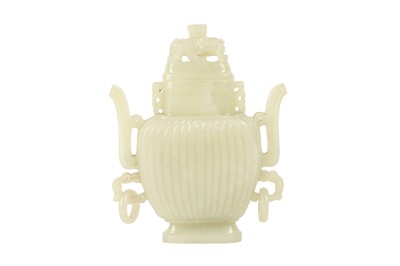 Lot 253 - A CHINESE PALE CELADON JADE VASE AND COVER.