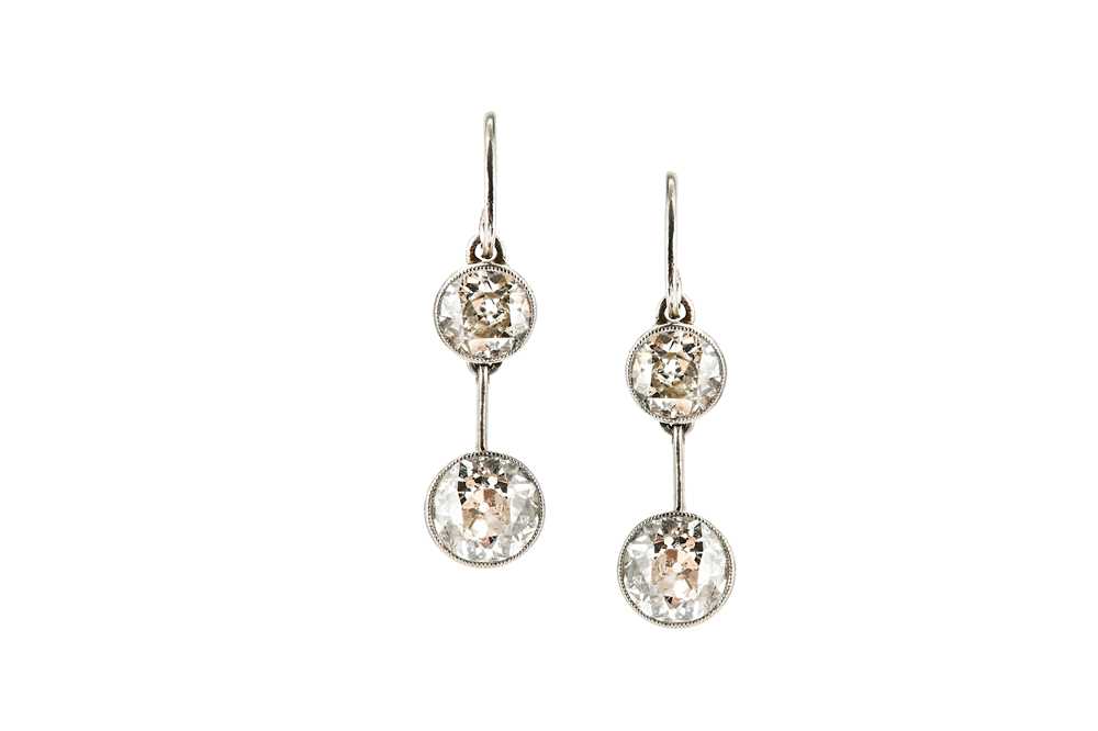 Lot 148 - A pair of diamond pendent earrings Each set...