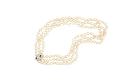 Lot 93 - A triple strand cultured pearl, sapphire and...