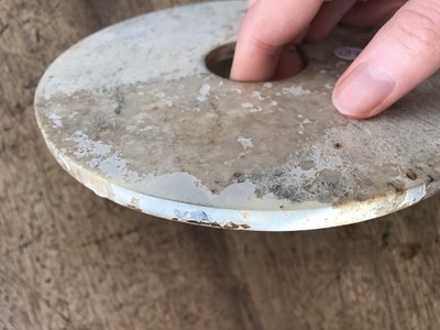 Lot 111 - THREE CHINESE JADE BI DISKS.