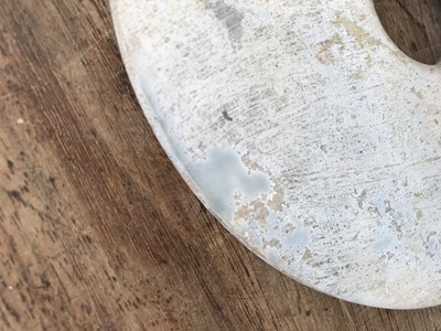 Lot 111 - THREE CHINESE JADE BI DISKS.