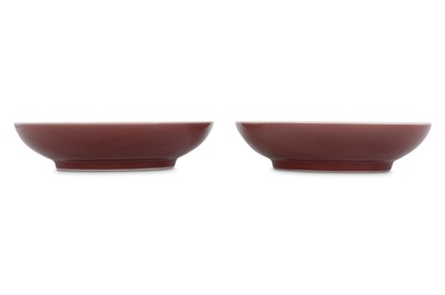 Lot 567 - A PAIR OF CHINESE RED-GLAZED DISHES.