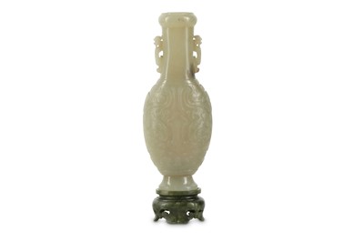 Lot 207 - A CHINESE CELADON JADE VASE WITH 'TAOTIE' MASK TOGETHER WITH A SPINACH JADE STAND.