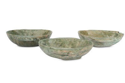 Lot 321 - THREE CHINESE GREEN-GLAZED POTTERY 'EAR' CUPS.