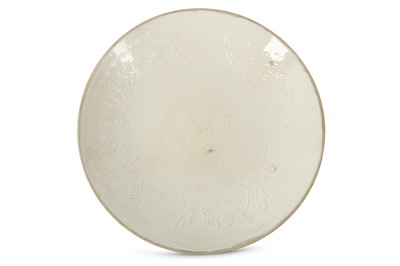 Lot 486 - A CHINESE CREAM-GLAZED 'LOTUS POND' MOULDED DISH.