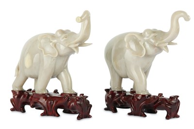Lot 209 - A PAIR OF CHINESE WHITE HARDSTONE ELEPHANTS.
