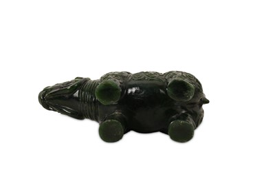 Lot 43 - A CHINESE SPINACH GREEN JADE 'RHINOCEROS' CARVING.