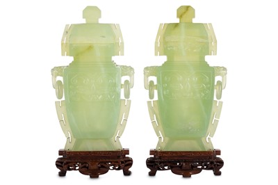 Lot 320 - A pair of Chinese serpentine vases and covers.