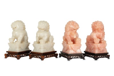Lot 550 - TWO PAIRS OF CHINESE HARDSTONE LION DOGS. One...