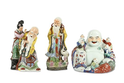 Lot 235 - A Chinese shoulao together with two other Chinese porcelain figurative groups.