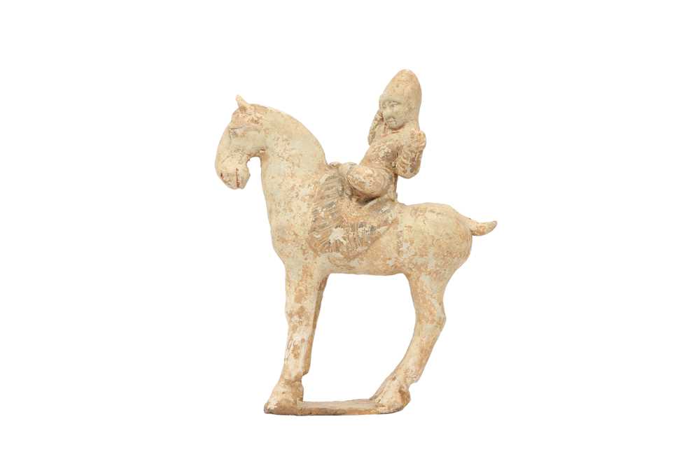 Lot 558 - A CHINESE POTTERY MODEL OF A HORSE AND RIDER.