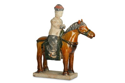 Lot 341 - A CHINESE SANCAI-GLAZED FIGURE OF A HORSE AND...