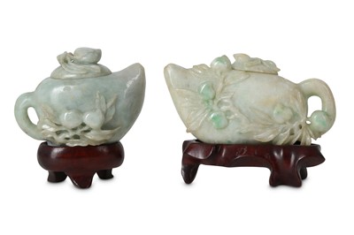 Lot 285 - Two Chinese apple-green jadeite 'peach' teapots and covers.