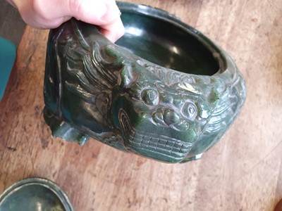 Lot 103 - A CHINESE SPINACH-GREEN JADE 'DRAGON' VESSEL AND COVER.
