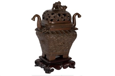 Lot 389 - A CHINESE BRONZE INCENSE BURNER AND COVER.