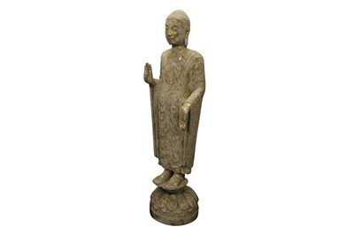Lot 323 - A CHINESE GILDED STONE FIGURE OF A STANDING BUDDHA