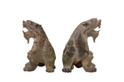 Lot 67 - A PAIR OF CHINESE JADE FIGURES OF LIONS.