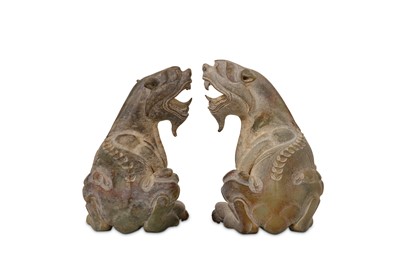 Lot 67 - A PAIR OF CHINESE JADE FIGURES OF LIONS.