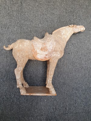 Lot 230 - A CHINESE POTTERY MODEL OF A HORSE.