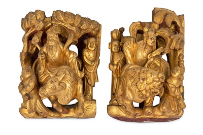 Lot 703 - A PAIR OF CHINESE GILT-WOOD RETICULATED 'IMMORTALS' PANELS.