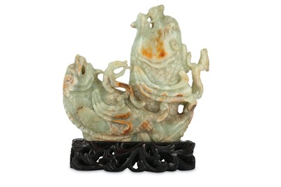 Lot 666 - A CHINESE PALE CELADON JADE ‘DOUBLE DRAGON FISH' CARVING.