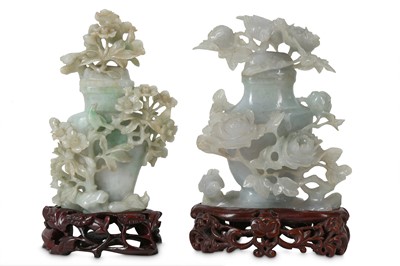 Lot 277 - Two Chinese apple-green jadeite 'birds and flowers' vases and covers.