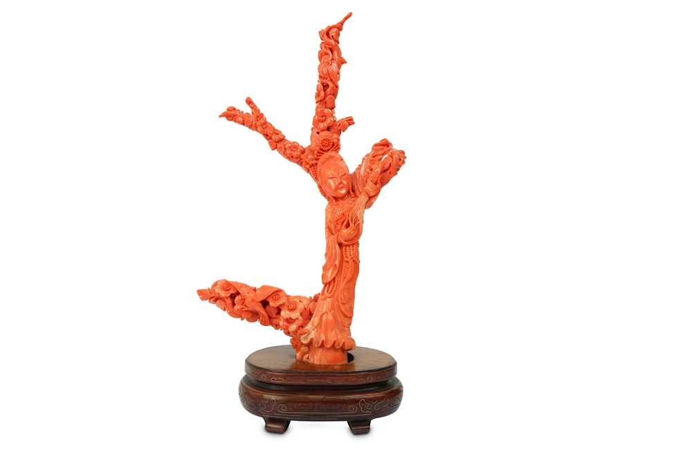 Lot 55 - A CHINESE CORAL CARVING OF AN IMMORTAL...