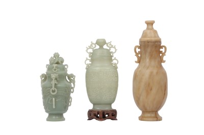 Lot 512 - A COLLECTION OF THREE CHINESE CARVED JADE VASES AND COVERS.