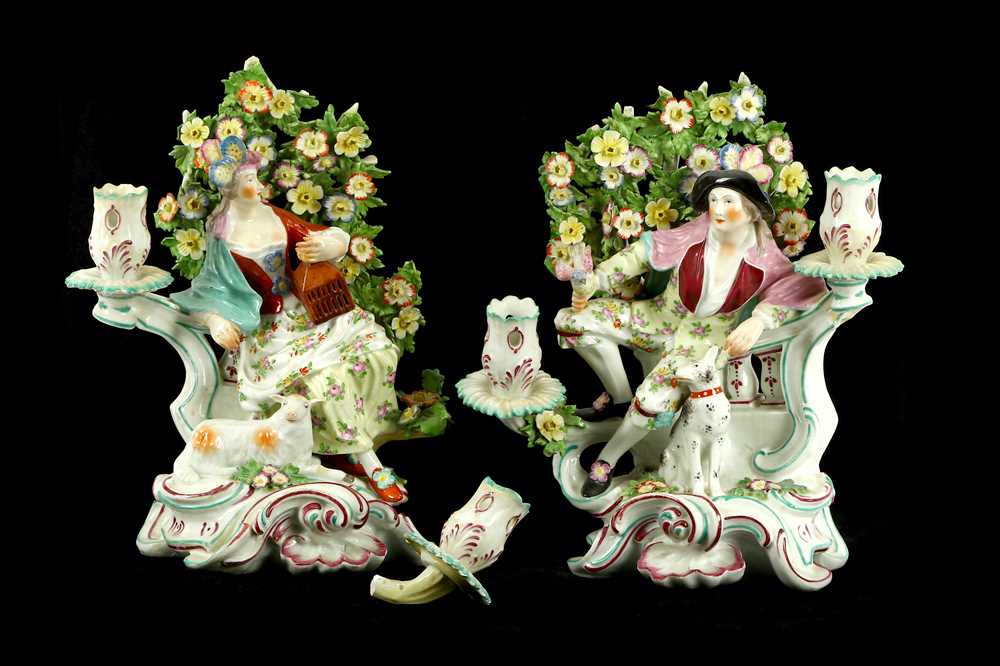 Lot 55 - A pair of Derby bocage candlestick figures,...