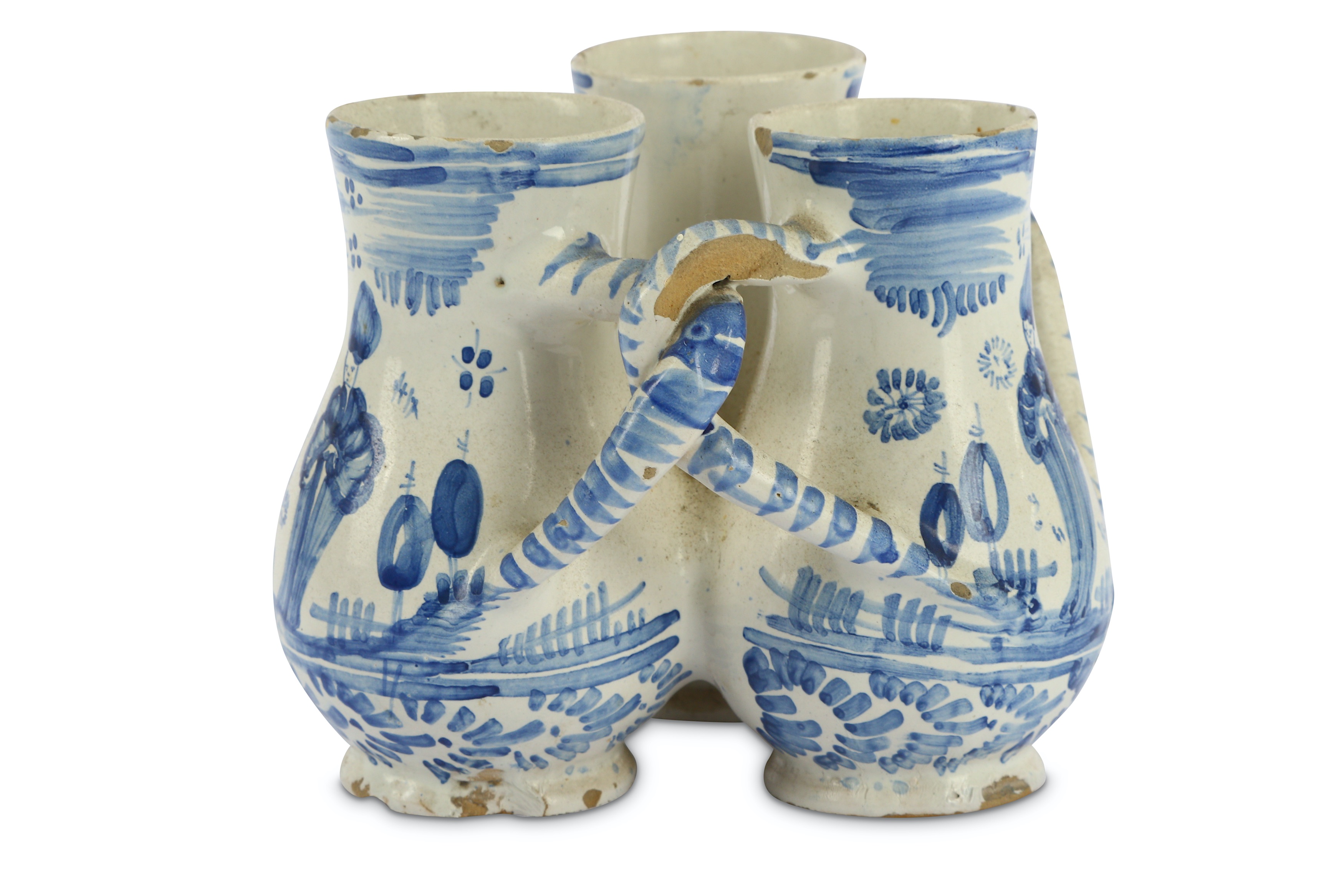 Lot 60 - A German fayence blue and white fuddling cup,