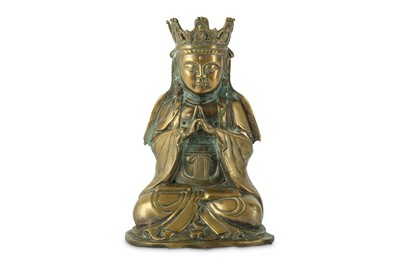 Lot 123 - A CHINESE BRONZE FIGURE OF GUANYIN. Seated...