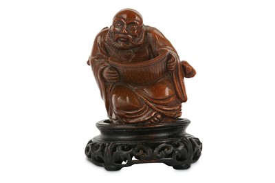 Lot 120 - A CHINESE TIGER EYE FIGURE OF A SAGE. The...
