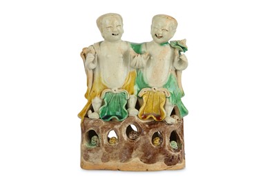 Lot 52 - A CHINESE SANCAI-GLAZED BISCUIT MODEL OF THE TWINS HEHE ERXIAN.