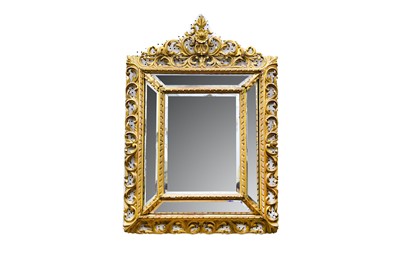 Lot 112 - A Baroque style cushion framed mirror, with...