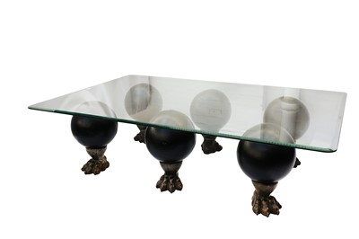Lot 125 - A contemporary glass topped coffee table, the...