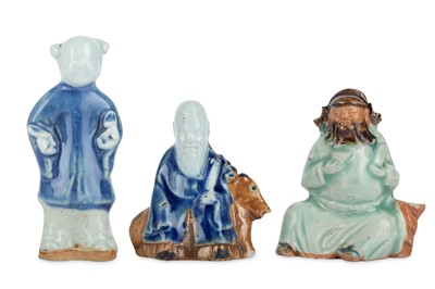 Lot 99 - THREE CHINESE GLAZED BISCUIT FIGURES. Qing...