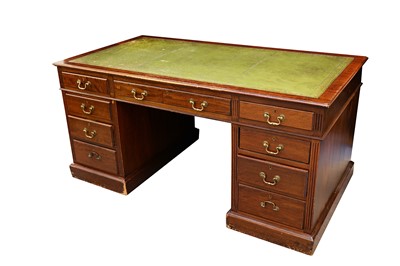 Lot 127 - A mahogany pedestal desk with a tooled green...