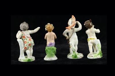 Lot 115 - A group of four porcelain cherub figures in...