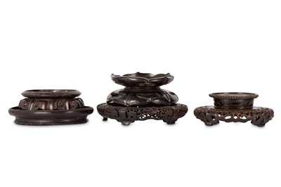 Lot 477 - FOUR CHINESE CIRCULAR WOOD STANDS. 24cm...