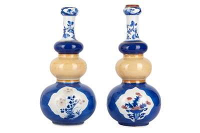 Lot 90 - A PAIR OF CHINESE TRIPLE GOURD VASES. Qing...