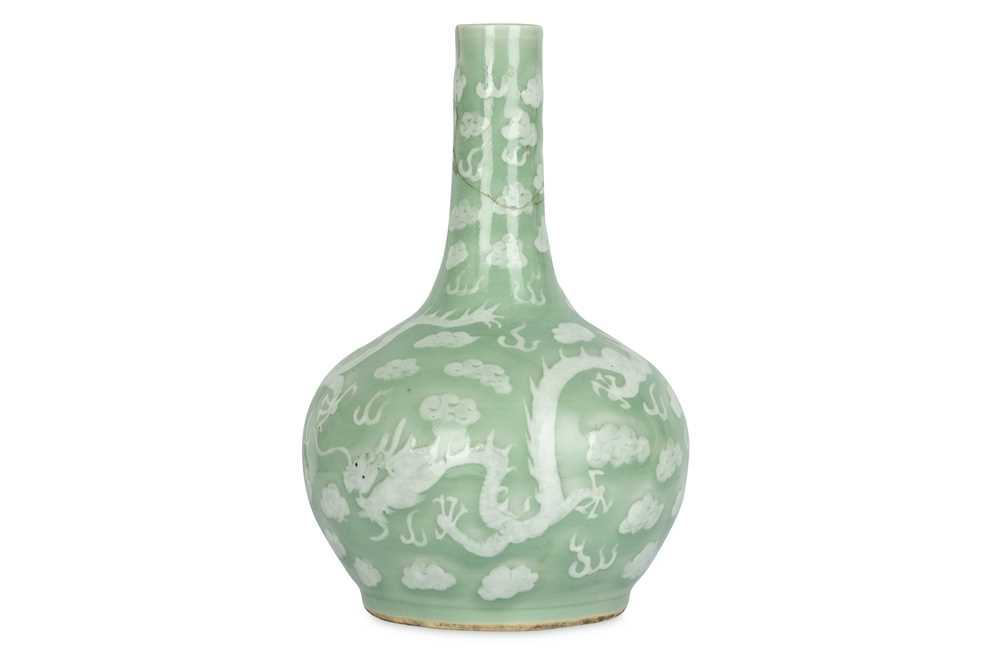 Lot 362 - A CHINESE CELADON-GLAZED SLIP-DECORATED...