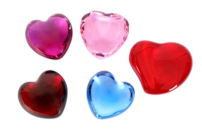 Lot 481 - A collection of five glass heart shaped...