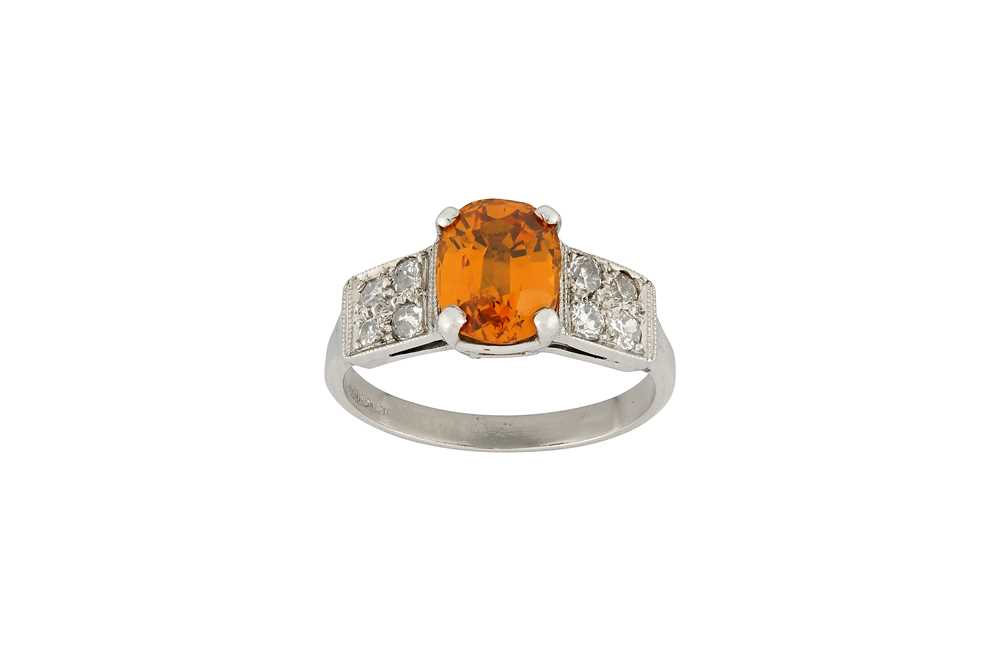 Lot 20 - An orange sapphire and diamond ring The...