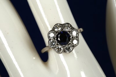 Lot 311 - An 18ct white gold, sapphire and diamond...