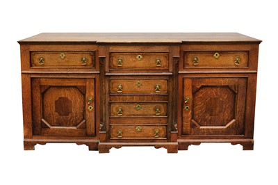 Lot 346 - A George III oak breakfront dresser, with...