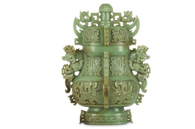 Lot 570 - A MASSIVE CHINESE CELADON JADE ARCHAISTIC VASE AND COVER.