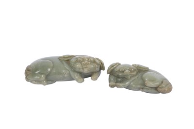 Lot 586 - A CHINESE PALE CELADON JADE CARVING OF A LION DOG.