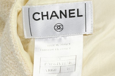 Lot 63 - Two Chanel and Chanel Boutique Cream Boucle Skirts - sizes 38 and 40