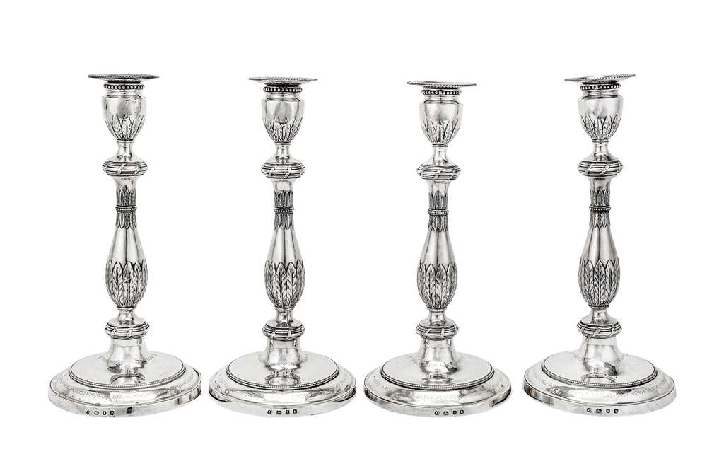 Lot 573 - A set of four George III sterling silver candlesticks, London 1778 by John Scofield (reg. 13th Jan 1778)